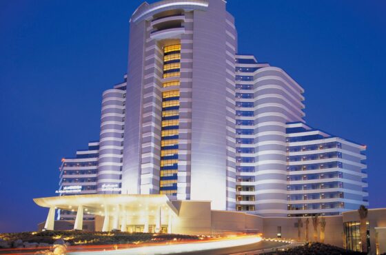 External facade of Al Aqah hotel in dubai with luxury finish, road leading up to hotel