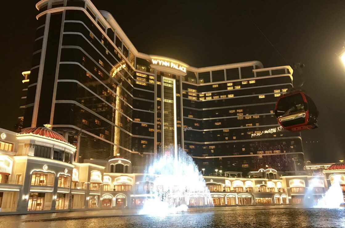 Night time image of Wynn Palace resort with water fountain in foreground
